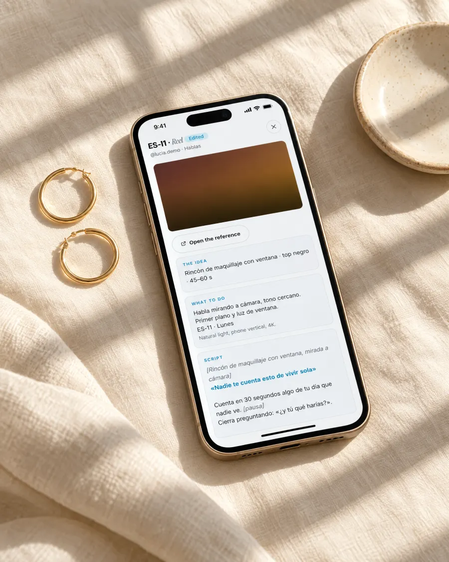 A phone on linen showing a piece's brief in fangrowz.